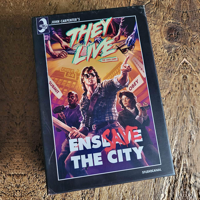 Couverture de They Live: The Card Game - Save The City/Enslave The City